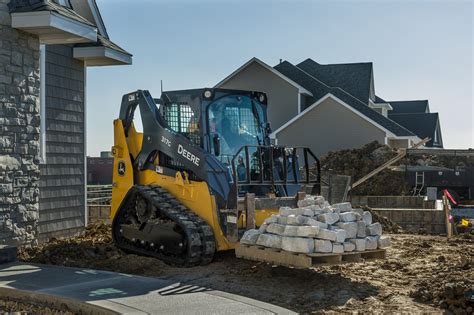 image skiers riding bicycle with skid steer|Mini Track Loaders .